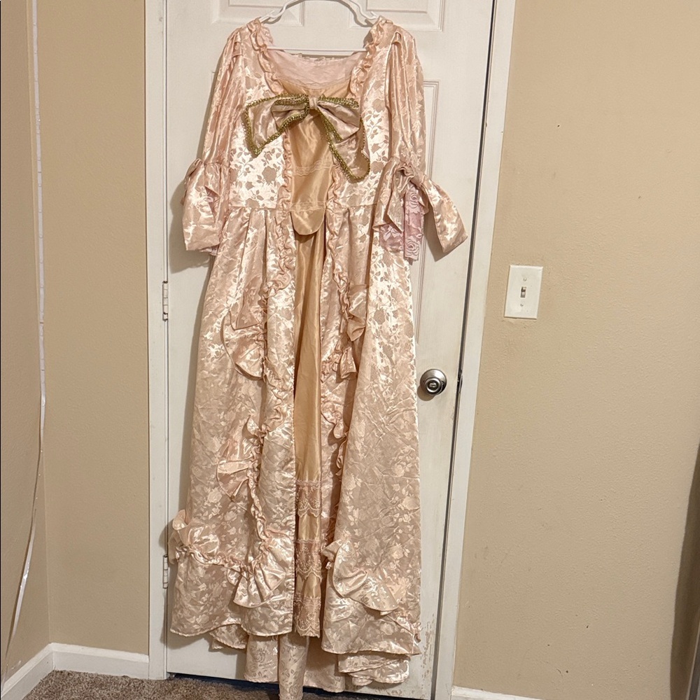 Elegant Pink Gown with Gold Bow